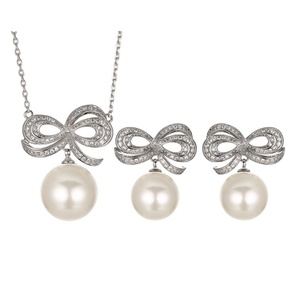 Ensemble de bijoux élégant et écologique en cuivre avec perles de coquillage de 14 mm, design nœud papillon, boucles d'oreilles et collier pour femmes, vente en gros - Product Image 1