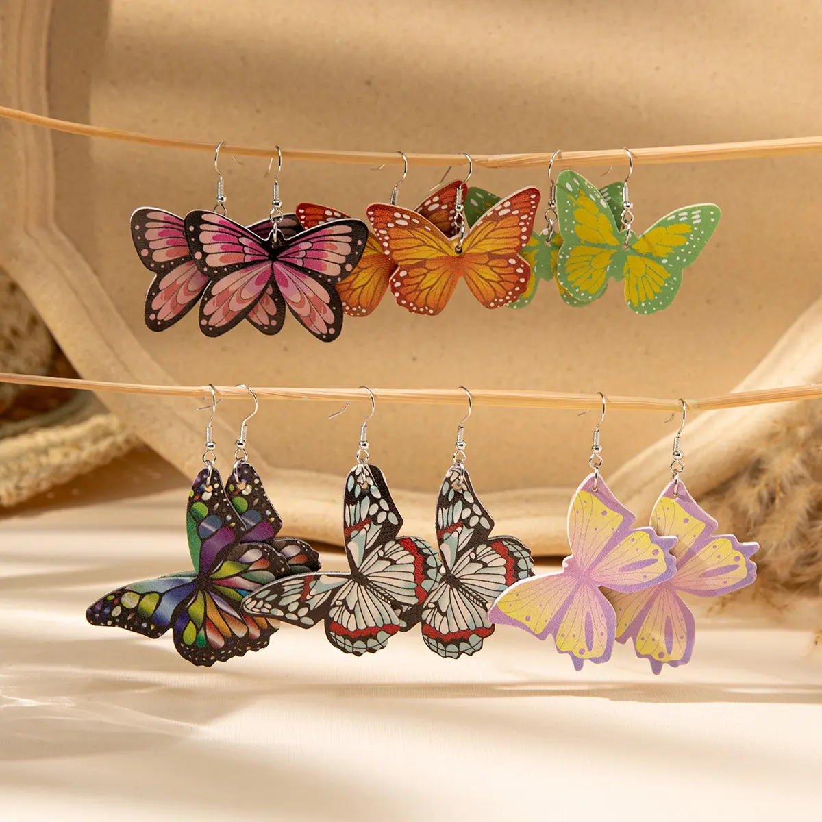 Brincos de borboleta étnica retrô pintados com personalidade boêmia PU joias da moda por atacado