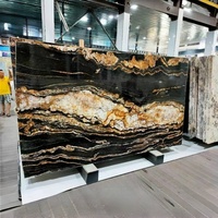 Dalle de granit de luxe en titane veiné noir et or