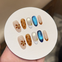 Faux ongles à presser peints à la main de qualité supérieure, motif floral écaille de tortue marron avec effet œil de chat bleu scintillant, vente en gros