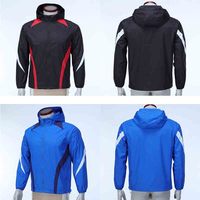 Veste coupe-vent unisexe imperméable en polyester durable avec capuche et blocs de couleur pour activités de plein air