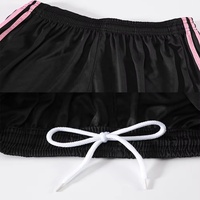 Uniforme de football pour hommes, rose à motifs, 100% polyester, respirant, maillot à manches courtes et short noir pour les entraînements quotidiens et les matchs