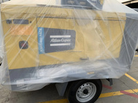Compresseur d'air à vis mobile portable à moteur diesel Atlas Copco XAHS400 PACE 5-12 bar 410-360cfm 12-10m³/min pour l'exploitation minière, le forage et les explosions