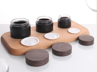 Pot cosmétique vide rechargeable en verre noir givré avec logo personnalisé Conteneur d'ombre à paupières crème pour le visage avec bouchon en grain de bois