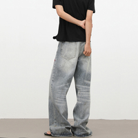 Pantalon en jean délavé style vintage, coupe droite et large, effet délavé à l'encre audacieuse, style streetwear américain décontracté
