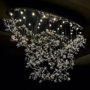 Luxury crystal multi-colored flower oval chandelier decorate the hotel lobby wedding hall background sky lights