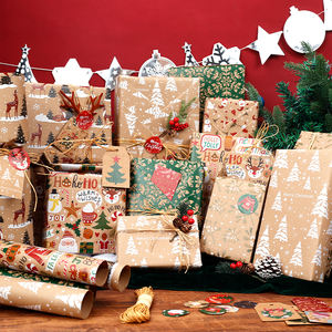 Venta al por mayor 80g Navidad oro estampado papel Kraft 43*300cm regalo lujo embalaje personalizado rollo de papel de regalo - Product Image 1