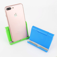 Support de téléphone portable en plastique réglable, support de bureau, designs gratuits pour smartphone et tablettes, cadeau original