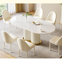 Ensemble de table et de chaises de salle à manger en acier carbone avec plateau en pierre moderne et luxueux (6 places) pour hôtel et usage domestique, construction durable