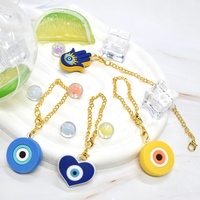 Vente en gros de chaînes de tasses mignonnes accessoires en forme de mauvais œil pour tasse breloques de couverture de paille accessoires pendentifs de tasse en verre