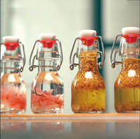 Bouteille en verre vide réutilisable de 60 ml (2 oz) avec bouchon à bascule hermétique, mini bouteille en verre pour boissons, lait, jus, kombucha