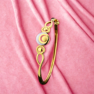Stylish circular motif <b>gold</b> bangle design for women with dual tone detailing modern lightweight jewellery elegant daily wear - Product Image 1