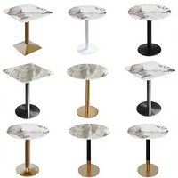 Ensemble de salon de bureau moderne et minimaliste en métal, style luxe léger, avec petite table ronde à plateau en pierre et quatre chaises, pour réceptions et réunions d'affaires