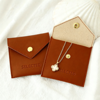 Pochette à bijoux en cuir à fermeture à pression, sac de rangement pour colliers et bagues, pochette enveloppe pour bracelets, pochette à bijoux gaufrée, sac anti-poussière pour bijoux