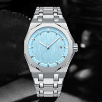 Montre pour homme avec lunette octogonale en acier inoxydable, cadran brossé, index lumineux, bracelet intégré, affichage de la date