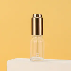 Botellas transparentes de vidrio de lujo de 10ml, botella cuentagotas con bomba de prensa dorada para Perfume, aceite esencial, suero, embalaje cosmético