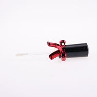 2026 En gros Tubes de brillant à lèvres en plastique de luxe, vides, avec nœud rouge et capuchon papillon, emballage unique pour rouge à lèvres