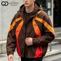 Veste coupe-vent à capuche imperméable pour homme, style streetwear, avec empiècements colorblock, coupe carrée, ourlet à cordon de serrage, pour l'extérieur et décontractée