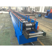 Machine de formage à froid entièrement automatique et personnalisée pour la fabrication de rails inférieurs de portes à enroulement en acier galvanisé
