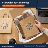 Sacs shopping en papier personnalisés OEM colorés, imprimé géométrique, œillets métalliques, poignées en corde tressée, durables pour les boutiques et les commerces de détail