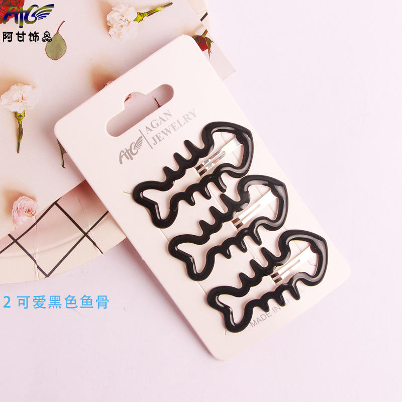 2 cute black fish bones