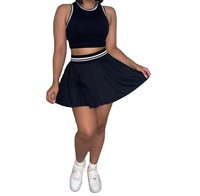 Ensemble 2 pièces tricoté décontracté et sportif pour femme : Crop top sans manches et jupe plissée – Collection été 2026