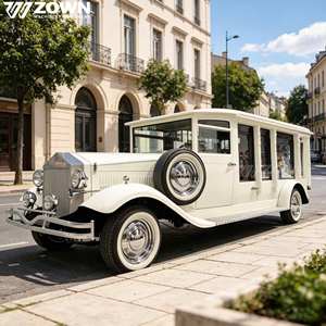 Limousine électrique blanche de style vintage avec roues chromées et intérieur élégant - Product Image 1