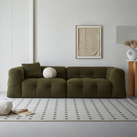 Canapé confortable en tissu bouclé au design rétro français 2025, idéal pour le salon ou la chambre d'étudiant