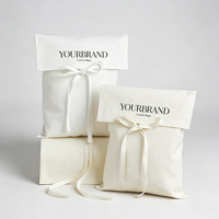 Élégant sac de rangement anti-poussière à rabat avec fermeture à nœud en ruban de satin, idéal pour les cosmétiques, les parfums et les produits de soin de la peau