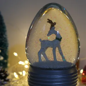 Palla di neve di natale palla di vetro ovale ornamento ago di pino albero di natale palla di cristallo globo di neve