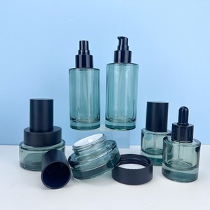 ชุดบรรจุภัณฑ์เครื่องสำอางระดับไฮเอนด์ 50 กรัม 30 มล. 50 มล. 100 มล. 120 มล. ขวดแก้วทรงแบนพร้อมหัวปั๊มโลชั่น ขวดเซรั่มแบบหยด และกระปุกครีม - Product Image 4