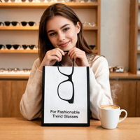 Sac en papier personnalisé pour lunettes avec design de monture noire pour emballage cadeau de magasin d'optique, vente en gros directe d'usine