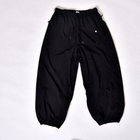 OEM celana salju hitam tahan air kustom dengan jaring laba-laba reflektif cetakan pinggang dapat disesuaikan lapisan hangat dan manset elastis