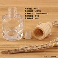 Bouteilles diffuseurs d'arômes ronds suspendus pour voiture de 8 ml, flacon de parfum pour voiture en verre avec bouchon à vis en bois, en vente