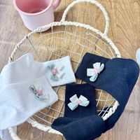 Chaussettes mi-mollet tendance pour femme, style japonais-coréen, en mélange de coton respirant, motif floral noir et blanc, pour usage quotidien décontracté