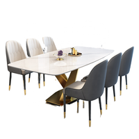 Ensemble de salle à manger extensible de luxe moderne avec 8 chaises, structure en métal et plateau en marbre pour usage hôtelier