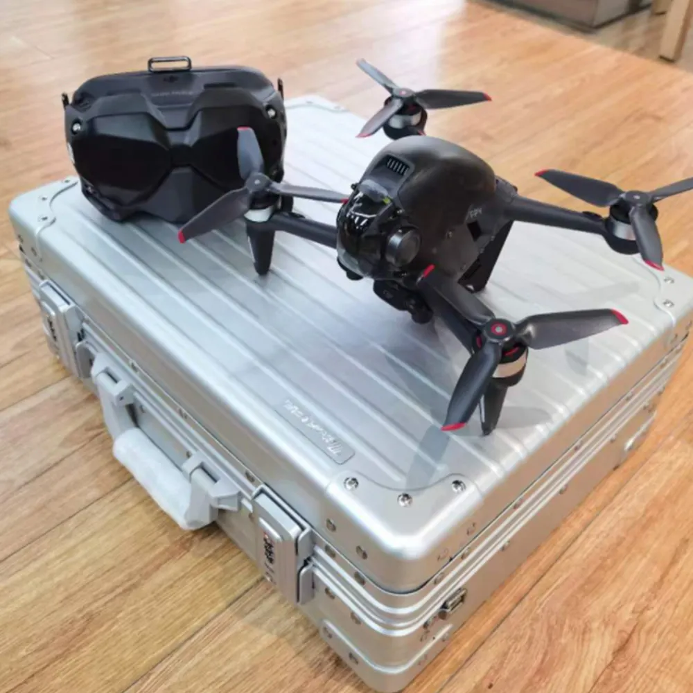 OEM ODM gümüş alüminyum kasa sanayi profesyonel araç kutusu drone durumda EVA köpük ile taşıma drone alüminyum taşıma kutusu