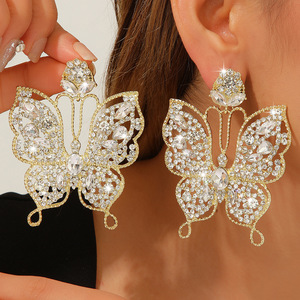 Boucles d'oreilles pendantes papillon en cristal coloré et strass, style luxe léger exagéré, pour femmes, mode niche haut de gamme, Europe et États-Unis - Product Image 1