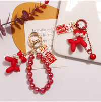 Perle bulle chien porte-clés pendentif mignon mignon dragon métal étiquette accessoires couple casque couverture décoration