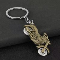 Porte-clés mousqueton moto de simulation cool en alliage de zinc, design roue rotative, résistant aux UV et à l'eau, pendentif de sac automobile, nouveauté, vente en gros