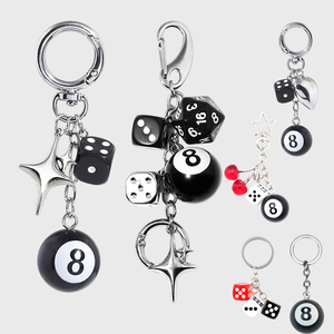 JS Wholesale 23 Styles Y2K Breloques de sac créatives avec cerise, étoile argentée, cœur, boule noire, dé, porte-clés pour femmes et hommes - Product Image 1