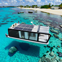 Maison flottante préfabriquée en aluminium, villa modulaire pour les vacances en famille, les séjours en hôtel et les locations de villas.
