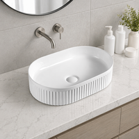 Lavabo ovale moderne en céramique blanche pour salle de bain, vasque à poser pour maison et hôtel