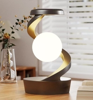 2025 nouveau produit chargeur sans fil flottant capteur de lévitation lumière de table lune lampe à suspension rotative pour chambre