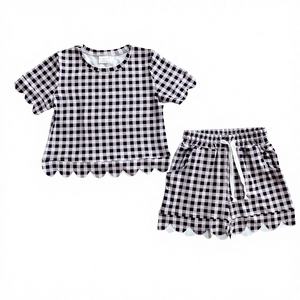 Conjunto de Ropa de Dos Piezas para Bebés Niñas, Diseño Personalizado, Fabricación Profesional OEM, Sin Mangas, Poliéster, Estampado a Cuadros Negros, Suave para el Verano - Product Image 1