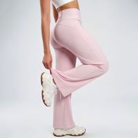 Pantalon de yoga taille haute couleur pêche uni avec poches arrière, coupe droite ample, design amincissant et rehausseur de silhouette