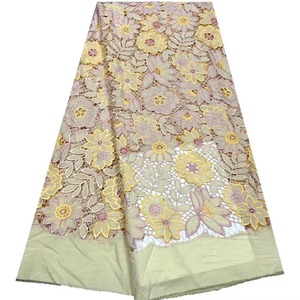 Tissu de broderie creux de luxe en dentelle de chrysanthème en stock du fabricant pour robes traditionnelles et sexy - Product Image 2
