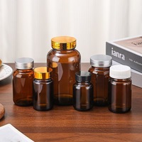 Bouteille en verre ronde à large ouverture de 60 ml, 75 ml, 100 ml, 120 ml, 150 ml, 200 ml, 400 ml, 500 ml avec bouchon à vis ambré pour le stockage de pilules pharmaceutiques