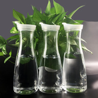 Pichet en plastique PC 1L-1.5L avec couvercle et poignée, idéal pour lait, jus, thé – Vente directe usine pour les commerces de boissons