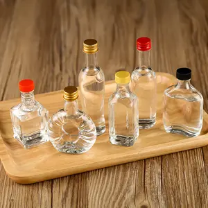 2023 New Wholesale 50ml 100ml Mini Small Sample Alcohol Juice Drinks Glass Wine Liquor Glass Bottle With Screw Lid For Sale